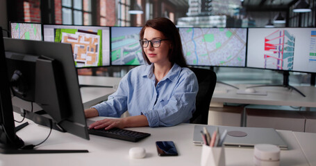 Fototapeta premium Young Woman Mastering GIS Software For Construction Inspection