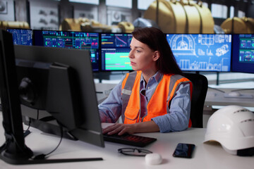 Skilled Woman Engineer Monitors SCADA System