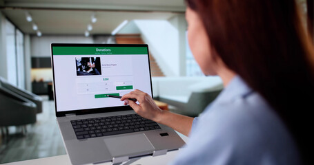 Young Woman Using Financial App To Donate To Nonprofit Fundraiser Online