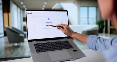 Young Woman Uploading Photo Into Online Cloud Storage For Future Security