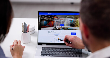 Young Couple Searching For Discount Hotel Online