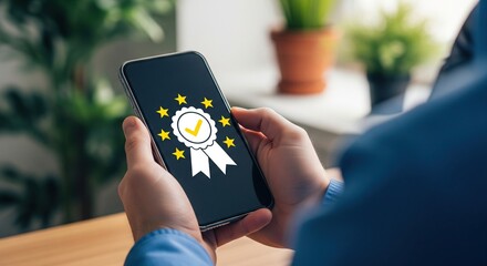 Person holding a smartphone displaying a digital award or badge icon