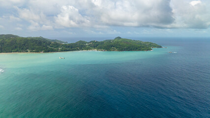 Aerial view of coastline of Mahe Island with bays and beaches. Seychelles.