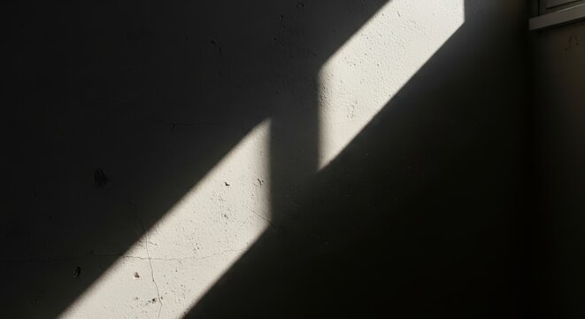 Strong diagonal beam of sunlight casts a sharp shadow on a wall - Powered by Adobe