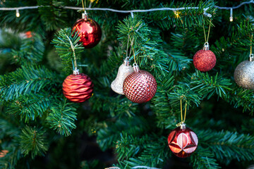 Fototapeta premium Close-up of Fully Decorated Christmas tree with red and White balls.