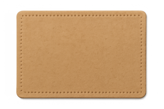 Blank leather patch or clothing label for jeans, having stitching holes along its rustic brown rectangular border