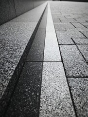 Close Up of Gray Granite Paving Stones and Curb in Urban Street Scene