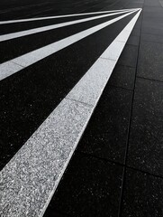 Black and White Asphalt Pedestrian Crosswalk with Bold Stripes in Modern Urban Setting
