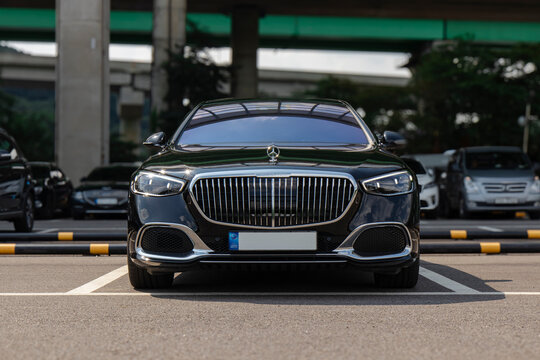 Front view of MAYBACH sedan with vertical chrome grille in outdoor parking - Seoul, South Korea - August 21 2022