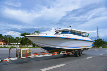 Fototapeta premium Speedboats and trailer hitch on road
