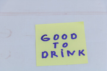 Good to drink handwritten note on yellow sticky paper