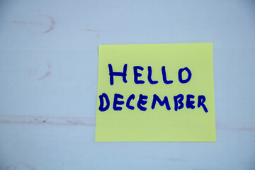 Hello December handwritten message on sticky note