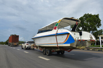 Fototapeta premium Speedboats and trailer hitch on road