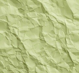 Obraz premium Pale lime green color crumpled paper texture, blank template wrinkly background with copy space