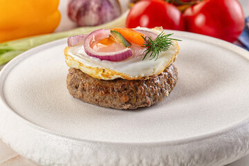 Beefsteak chop with roasted egg