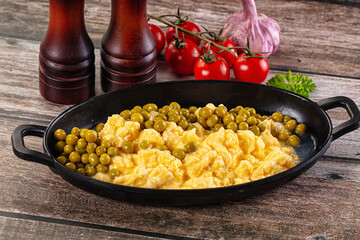Scrambled egg omelet with green peas