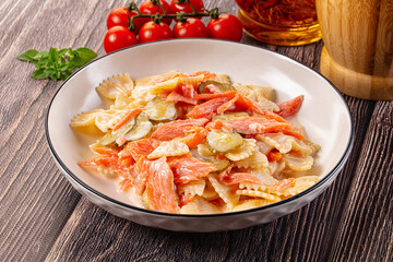Italian pasta farfalle with salmon
