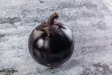 Raw round black big eggplant
