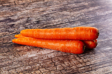 Young orange ripe carrot heap