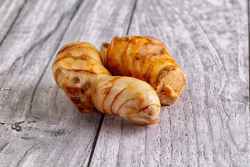 Raw galangal roots heap seasoning