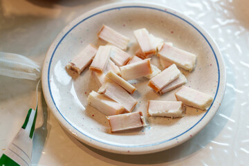 Slices of salo on a decorative plate provide a taste of ukrainian culture, prepared as an appetizer