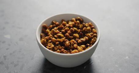 dried seaberry in white bowl on terrazzo countertop