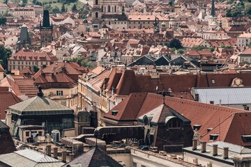 Panoramic view of historic european city rooftops under a bright sky