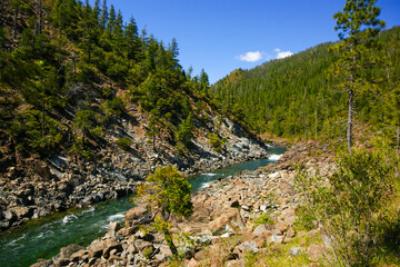 Pristine Smith River running through rugged rocky canyon in Northern California wilderness