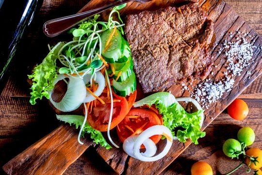 Hearty whole grain bread topped with fresh vegetables and greens