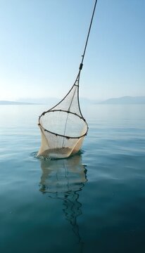 A fishing net floating on top of a body of water.