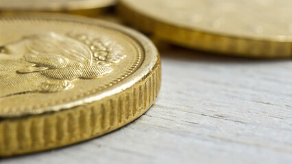 A close up stack of gold coins represents global currency and financial business