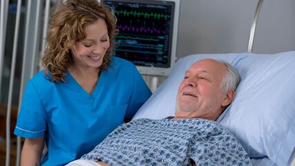 Smiling nurse caring for elderly patient hospital bed with medical monitor visible compassionate bedside care monitoring heart rate healthcare