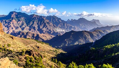 Obraz premium Majestic Mountain Range Under a Clear Blue Sky.