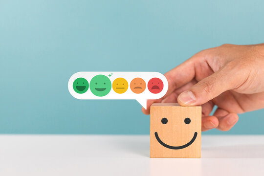 Excellent, positive feedback, service rating and satisfaction. Customers put down wooden cube with rating feedback scale indicates the highest level of satisfaction with the service