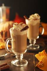 Glasses with warm pumpkin latte
