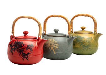 Three teapots with bamboo handles in a row