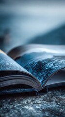 Close Up Of Open Book With Dark Blue Pages