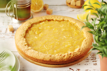A tart with lemon marmalade served on the table	