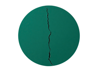 Cracked, dark teal, circular object on black