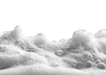 White, frothy bubbles atop a black background