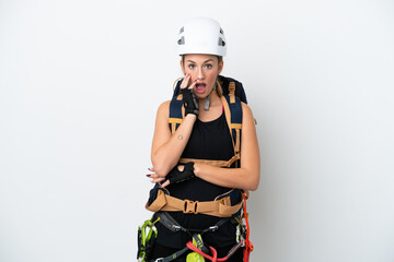 Young caucasian rock climber woman isolated on white background surprised and shocked while looking right