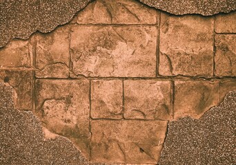 Ancient stone wall texture with cracked and weathered surface