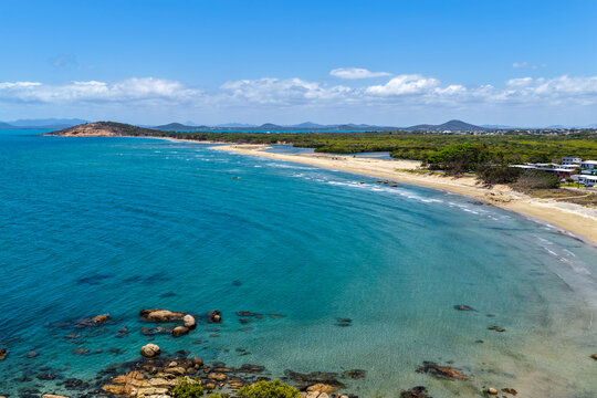 aerial view of Rose Bay in Bowen, Queensland, showcasing turquoise waters and rocky headland