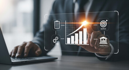 Businessman analyzing digital growth chart with strategic planning icons on virtual interface.