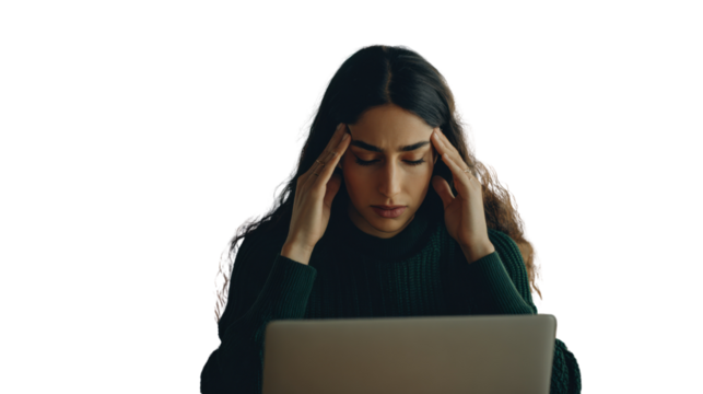 Stressed Work: A woman, head in hands, experiencing stress while working with laptop. Capturing the feeling of exhaustion, pressure, and overwhelmed.