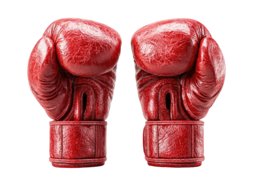 Two worn, red leather boxing gloves face forward