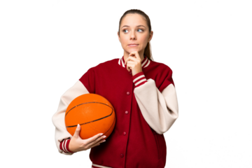 Young blonde woman playing basketball over isolated chroma key background having doubts and thinking