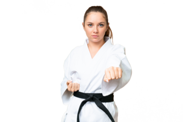 Young blonde woman over isolated chroma key background doing karate