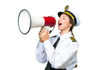 Airplane pilot woman over isolated chroma key background shouting through a megaphone