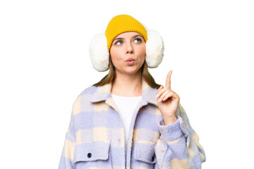 Young blonde woman wearing winter muffs over isolated chroma key background thinking an idea pointing the finger up